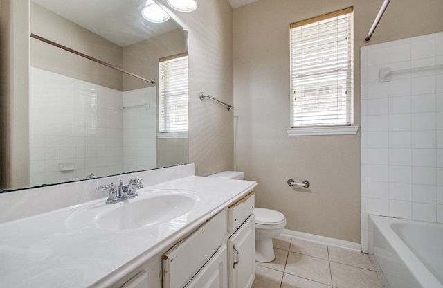 full bath featuring tile patterned flooring, vanity, toilet, baseboards, and  shower combination