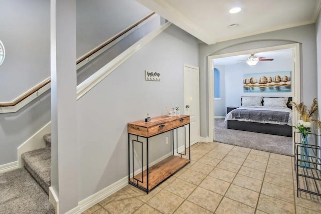 207 Knox St, Houston, TX 77007 - corridor with light tile patterned floors, baseboards, light colored carpet, and stairs