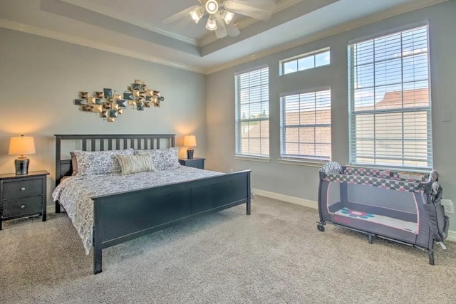 207 Knox St, Houston, TX 77007 - carpeted bedroom with ceiling fan, crown molding, a raised ceiling, and baseboards