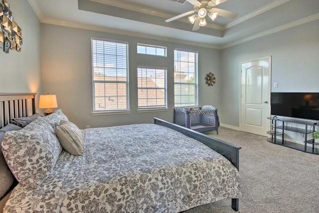 207 Knox St, Houston, TX 77007 - carpeted bedroom with ceiling fan, baseboards, crown molding, and a tray ceiling