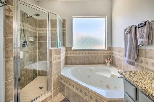 207 Knox St, Houston, TX 77007 - bathroom featuring a tub with jets, a stall shower, and vanity