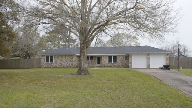 ranch-style house with driveway, a front yard, an attached garage, and fence