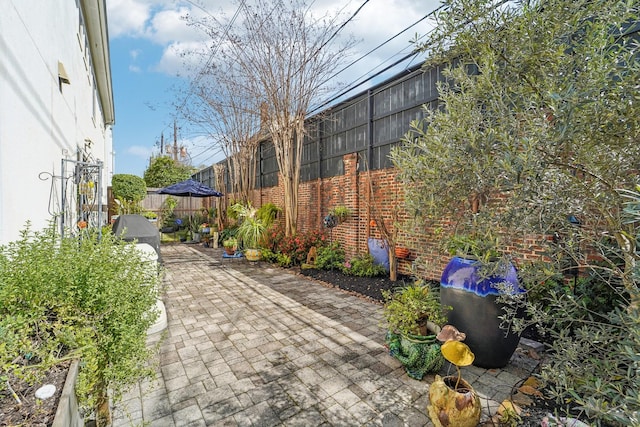 view of patio featuring fence