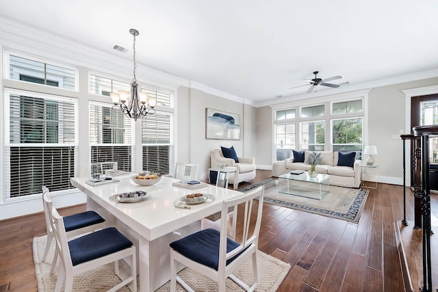 805 Columbia St, Houston, TX 77007 - dining area featuring crown molding, a chandelier, a ceiling fan, dark wood-style floors, and baseboards