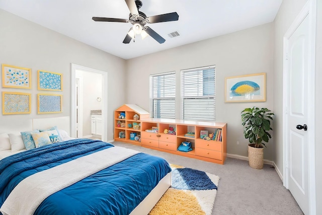 805 Columbia St, Houston, TX 77007 - carpeted bedroom with baseboards, ceiling fan, and connected bathroom