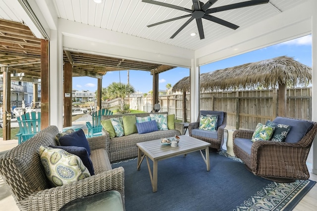 22102 Pecos Dr, Galveston, TX 77554 - view of patio with an outdoor living space, ceiling fan, and fence