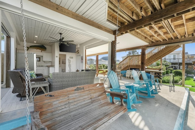 22102 Pecos Dr, Galveston, TX 77554 - deck featuring outdoor dining area, a ceiling fan, and outdoor lounge area