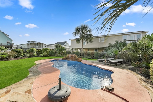 22102 Pecos Dr, Galveston, TX 77554 - view of swimming pool with a patio area, a lawn, and a fenced in pool