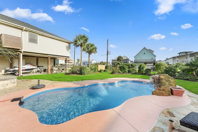 22102 Pecos Dr, Galveston, TX 77554 - pool featuring a patio and a lawn
