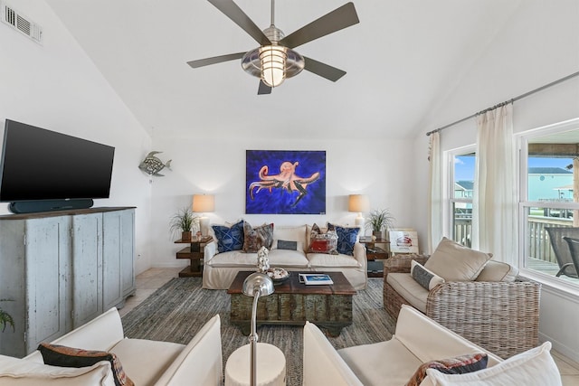 22102 Pecos Dr, Galveston, TX 77554 - living area with visible vents, ceiling fan, and vaulted ceiling