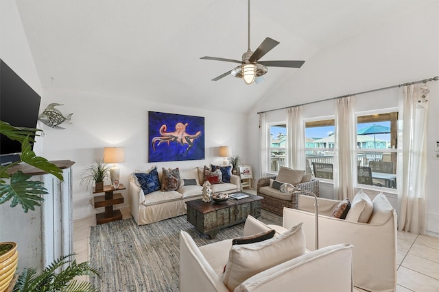 22102 Pecos Dr, Galveston, TX 77554 - living room featuring light tile patterned flooring, ceiling fan, and vaulted ceiling
