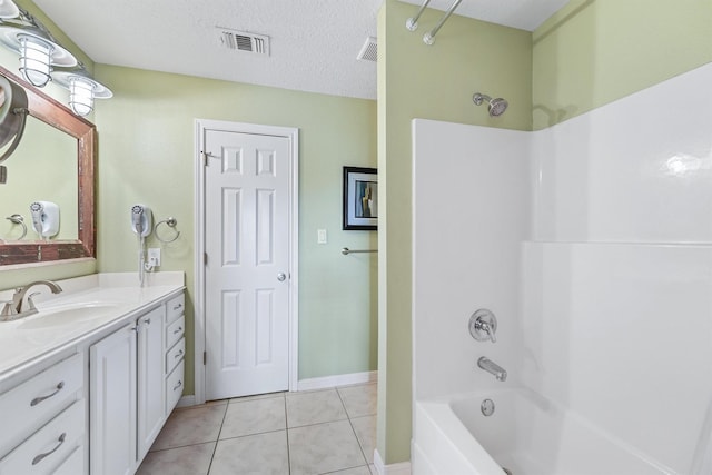 22102 Pecos Dr, Galveston, TX 77554 - bathroom featuring visible vents, shower / tub combination, tile patterned floors, a textured ceiling, and vanity