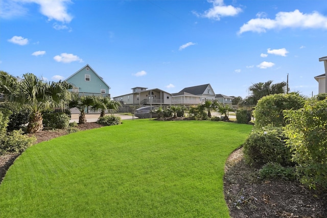 22102 Pecos Dr, Galveston, TX 77554 - view of yard with a residential view and fence