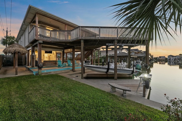 22102 Pecos Dr, Galveston, TX 77554 - view of dock with a water view, a patio, a yard, stairway, and boat lift