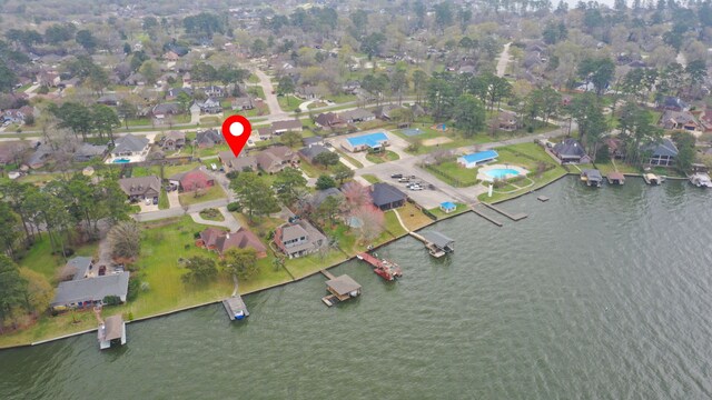 12604 Pegasus Dr, Willis, TX 77318 - drone / aerial view with a residential view and a water view