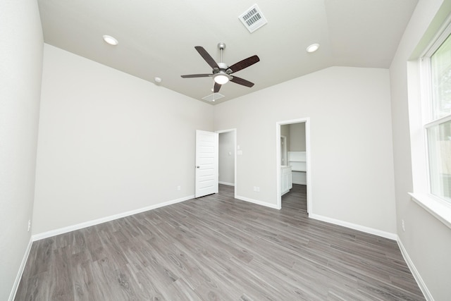 3626 Spy Glass Hill Dr, Montgomery, TX 77356 - unfurnished bedroom with multiple windows, baseboards, visible vents, and light wood-style floors