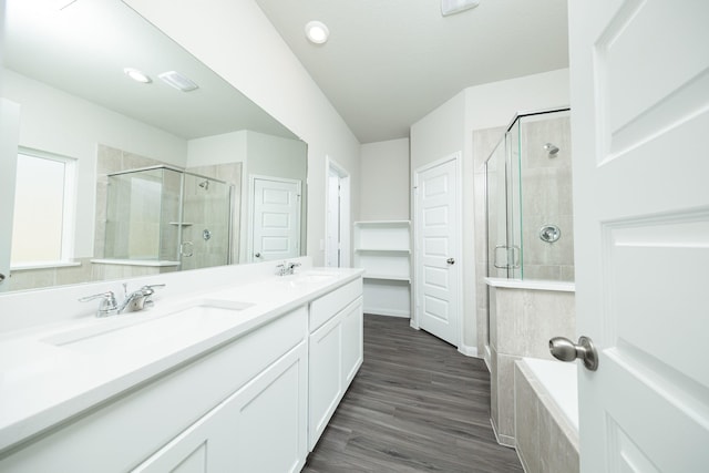3626 Spy Glass Hill Dr, Montgomery, TX 77356 - bathroom featuring double vanity, wood finished floors, a stall shower, and a sink