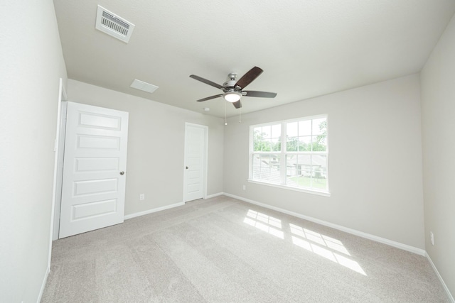 3626 Spy Glass Hill Dr, Montgomery, TX 77356 - unfurnished room featuring carpet flooring, visible vents, baseboards, and ceiling fan