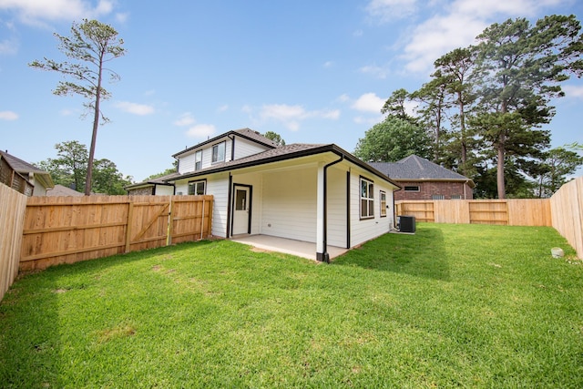 3626 Spy Glass Hill Dr, Montgomery, TX 77356 - back of property with central air condition unit, a fenced backyard, a patio, and a lawn
