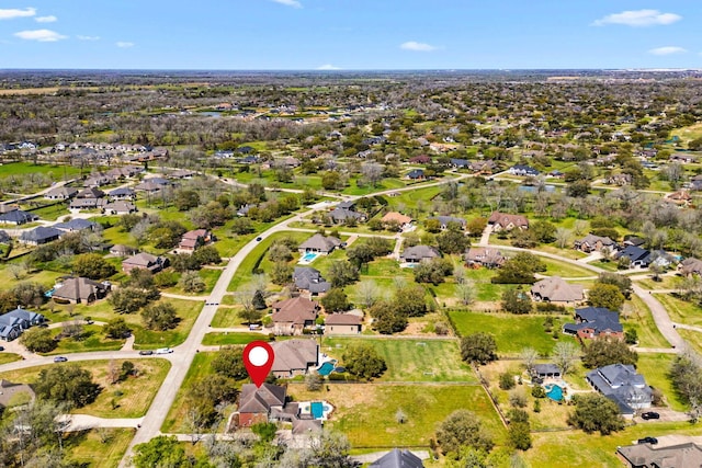 aerial view of property's location with nearby suburban area