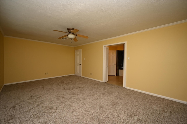 unfurnished room featuring crown molding, ceiling fan, baseboards, and carpet floors