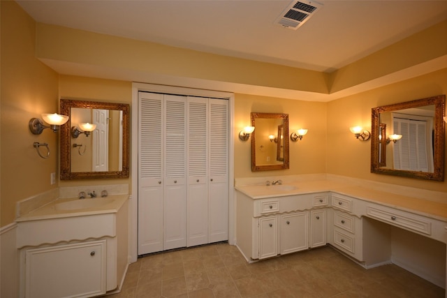 full bathroom with vanity and visible vents