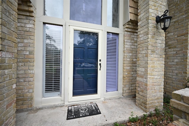 entrance to property with stone siding