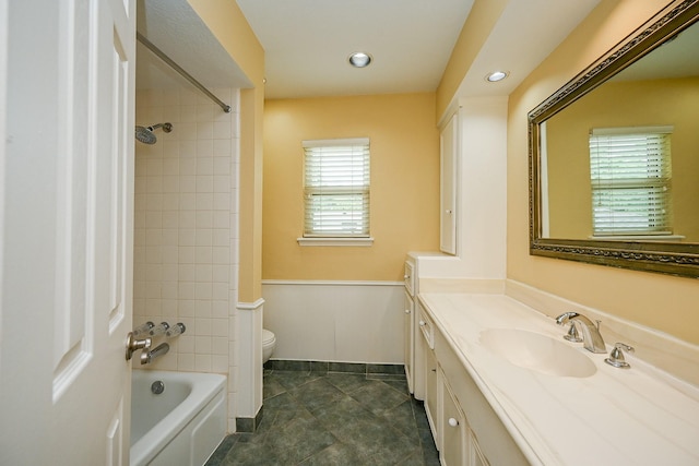 bathroom with bathtub / shower combination, vanity, recessed lighting, toilet, and baseboards