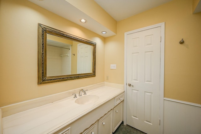 bathroom featuring recessed lighting and vanity