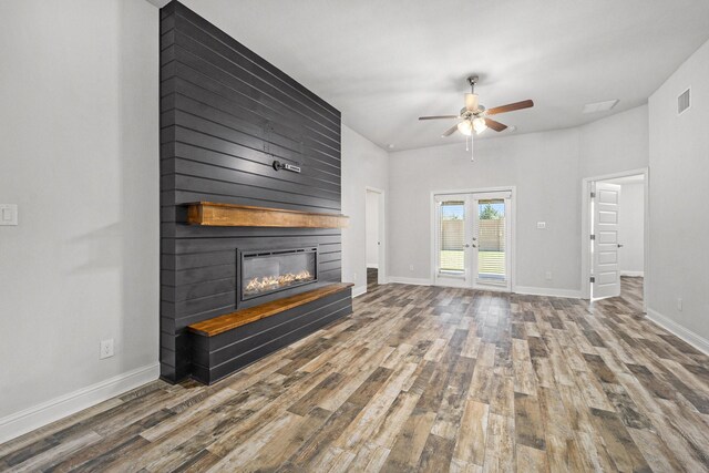 4306 Chadwick Rd, Texas City, TX 77591 - living room with visible vents, a fireplace, a ceiling fan, and wood finished floors