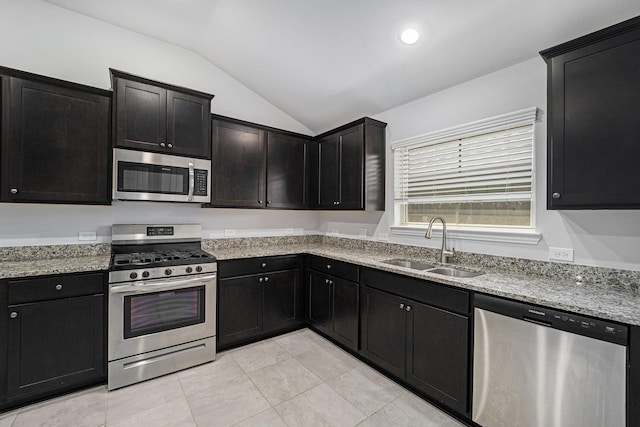 4306 Chadwick Rd, Texas City, TX 77591 - kitchen with a sink, vaulted ceiling, light stone counters, and stainless steel appliances