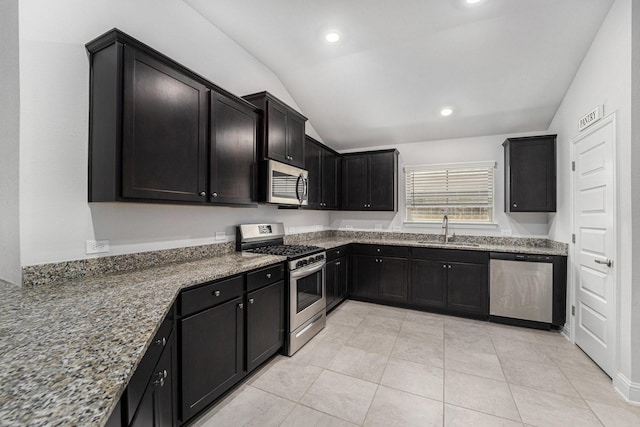 4306 Chadwick Rd, Texas City, TX 77591 - kitchen featuring stone counters, lofted ceiling, appliances with stainless steel finishes, and a sink