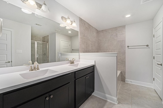 4306 Chadwick Rd, Texas City, TX 77591 - full bathroom featuring double vanity, tiled shower, baseboards, and a sink