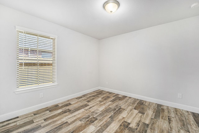 4306 Chadwick Rd, Texas City, TX 77591 - unfurnished room with baseboards and wood finished floors