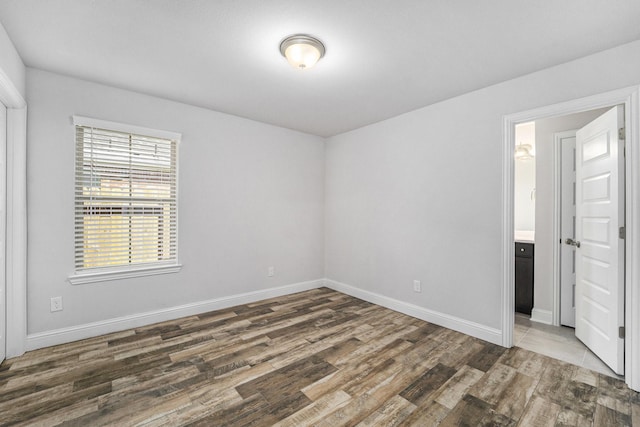 4306 Chadwick Rd, Texas City, TX 77591 - spare room featuring baseboards and wood finished floors