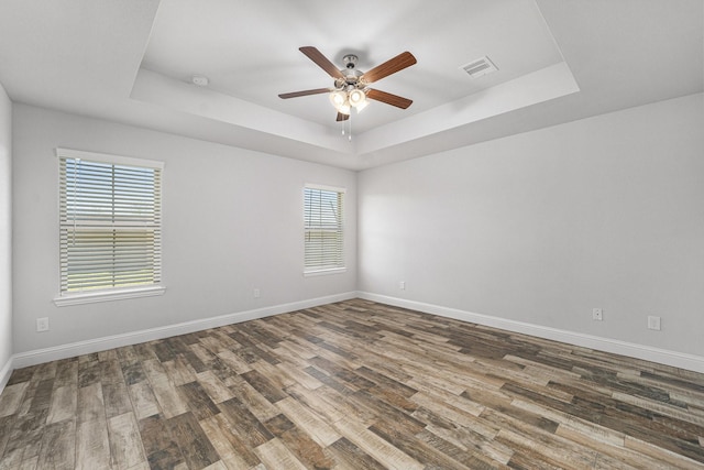 4306 Chadwick Rd, Texas City, TX 77591 - unfurnished room with visible vents, a raised ceiling, and a ceiling fan