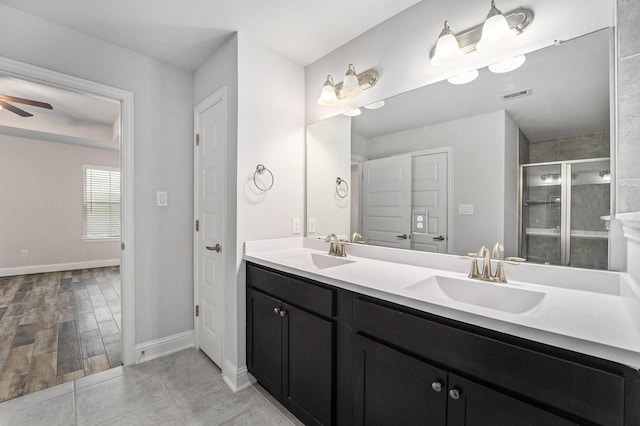 4306 Chadwick Rd, Texas City, TX 77591 - full bath with visible vents, a shower stall, ceiling fan, and a sink