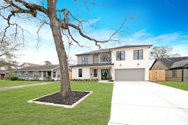 view of front facade with a front lawn, stucco siding, concrete driveway, an attached garage, and fence