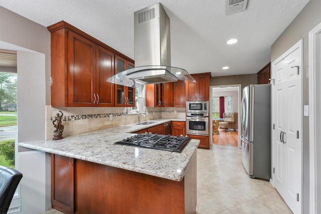 12635 Ivyforest Dr, Cypress, TX 77429 - kitchen with stainless steel appliances, visible vents, a wealth of natural light, and island range hood