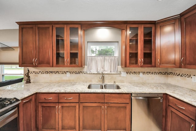 12635 Ivyforest Dr, Cypress, TX 77429 - kitchen featuring plenty of natural light, appliances with stainless steel finishes, decorative backsplash, and a sink