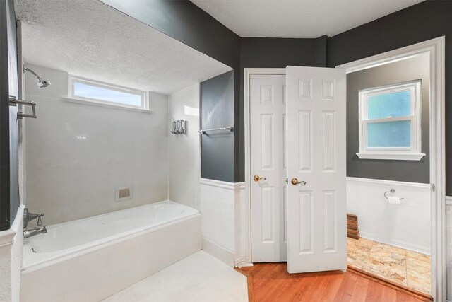 12635 Ivyforest Dr, Cypress, TX 77429 - bathroom with wood finished floors and a textured ceiling