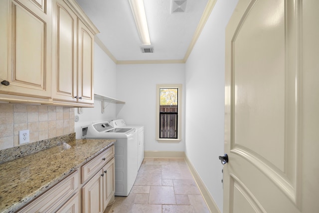 4628 Beech St, Bellaire, TX 77401 - washroom featuring stone tile floors, crown molding, baseboards, cabinet space, and independent washer and dryer