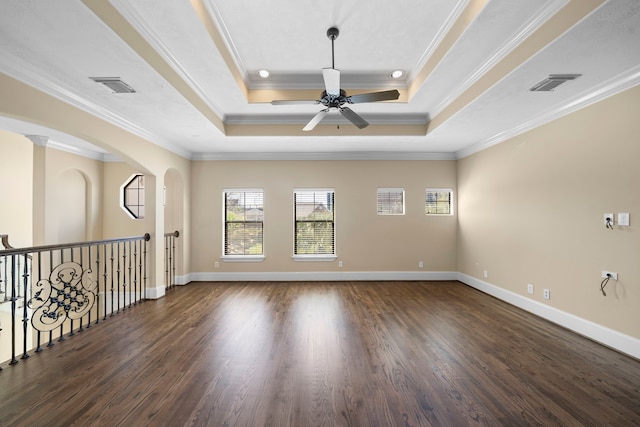 4628 Beech St, Bellaire, TX 77401 - spare room with wood finished floors, a raised ceiling, a ceiling fan, ornamental molding, and baseboards