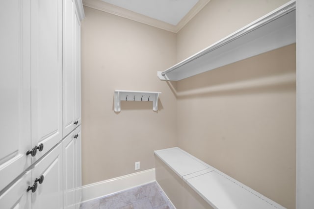 4628 Beech St, Bellaire, TX 77401 - mudroom featuring ornamental molding and baseboards