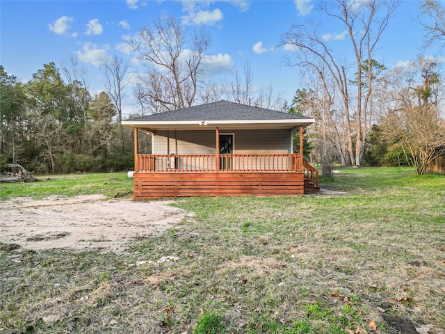 301 Pineland Dr, Trinity, TX 75862 - view of front of house with a front yard and roof with shingles