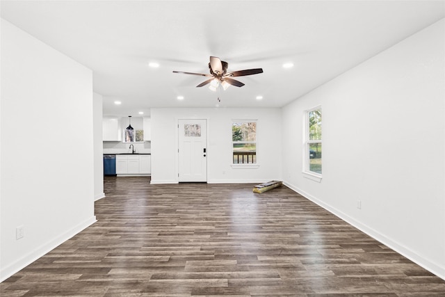 301 Pineland Dr, Trinity, TX 75862 - unfurnished living room featuring recessed lighting, baseboards, ceiling fan, and dark wood-style flooring