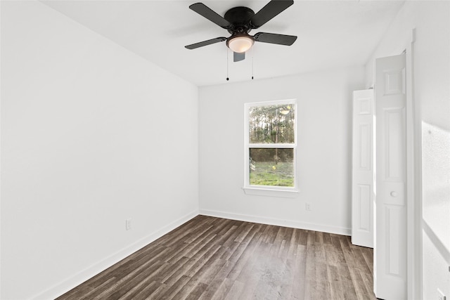 301 Pineland Dr, Trinity, TX 75862 - unfurnished bedroom featuring baseboards, dark wood-type flooring, and ceiling fan