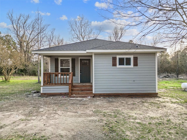 301 Pineland Dr, Trinity, TX 75862 - bungalow-style home featuring covered porch and roof with shingles