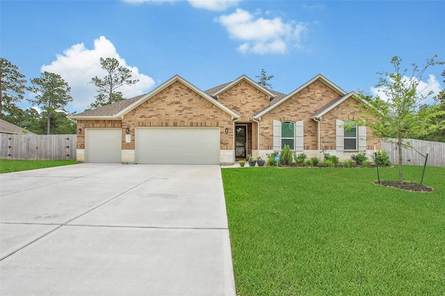 139 Jim Hall Ln, New Waverly, TX 77358 - view of front facade with a garage, brick siding, and concrete driveway