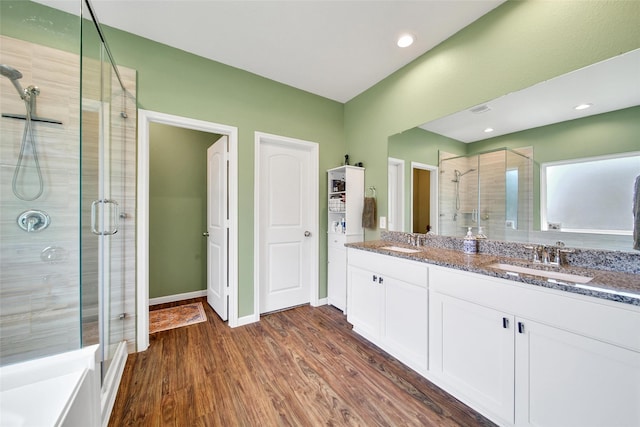 139 Jim Hall Ln, New Waverly, TX 77358 - full bath featuring a shower stall, wood finished floors, and double vanity